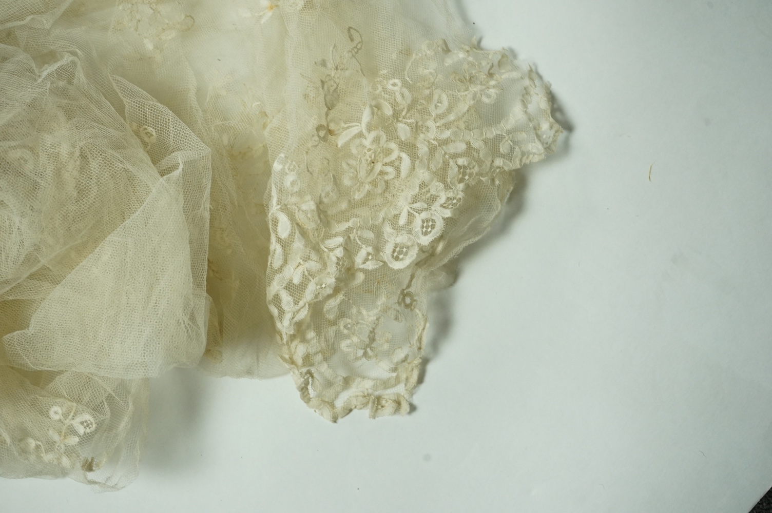 A Honiton lace wedding veil, (that has been cut into pieces), a Honiton edged collar, white worked jabot, various lace hankies etc. condition variable, very useful for theatre and film costume dramas.